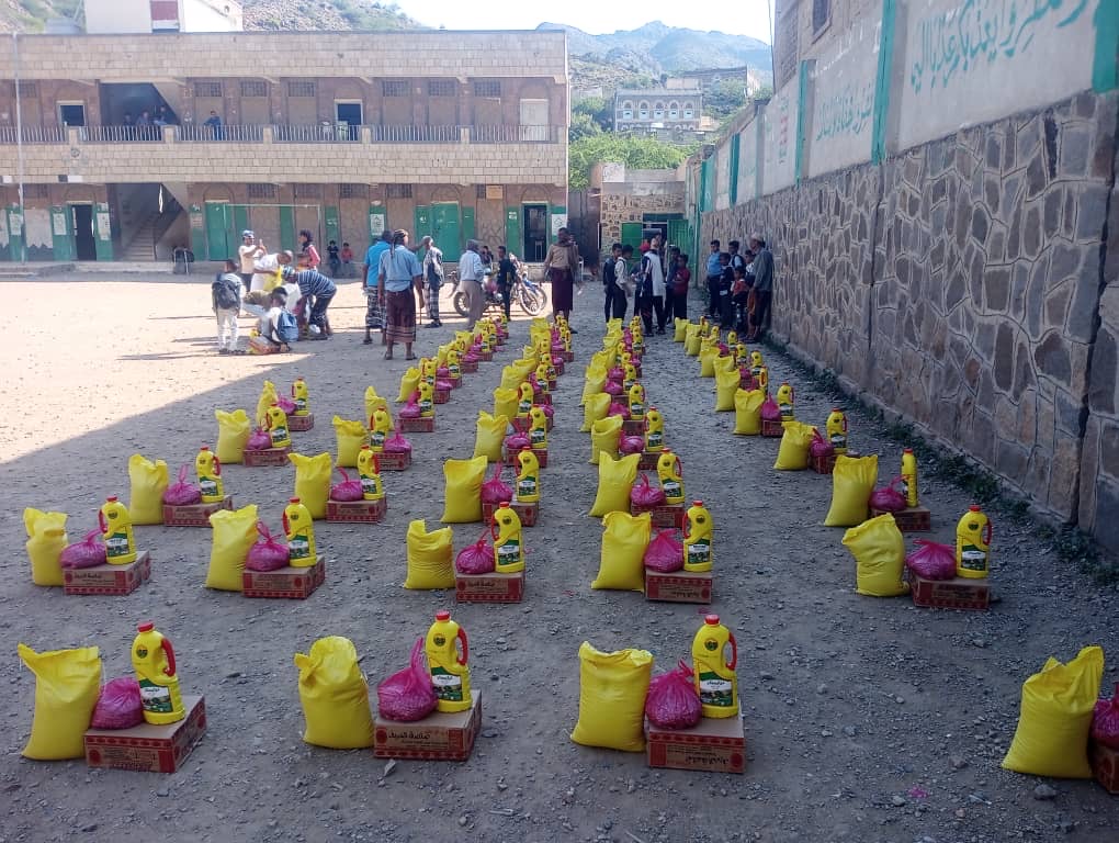 Yemen food assistance - Community members receiving essential food supplies during distribution